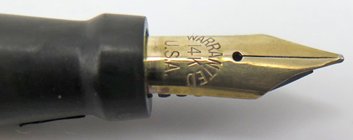 ITEM #1255: WARANTED GREEN GARBLE DESK PEN. LEVER FILLER. NIB IS BROAD. 