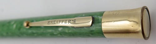 ITEM #2721: SHEAFFER BALANCE FLAT TOP JADE GREEN PENCIL. GOLD FILL TRIM. CHROME PLATED TRIM. Mechanism works both ways. Takes 0.046" Lead. No dents in derby.