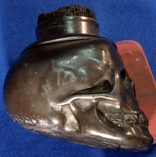 SKULL SHAPED VICTORIAN PEN CLEANER WITH HAT ON