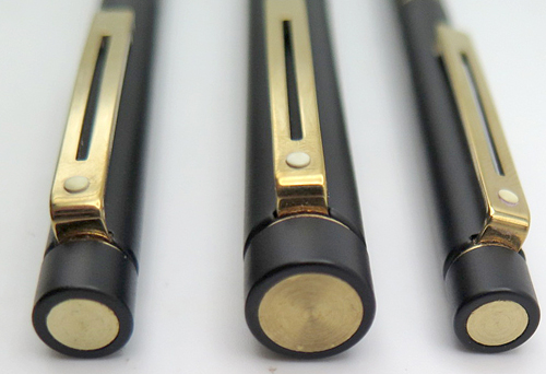 ITEM #4805: SET OF THREE. SHEAFFER OVERSIZE TARGA IN BLACK LACQUOR ON METAL. GOLD ELECTROPLATED TRIM. FOUNTAIN PEN HAS 14K NIB IN MEDIUM. SHEAFFER SQUEEZE FILLING UNIT. PENCIL IS TWIST ACTUATED. BALLPOINT ASLO TWIST ACTUATED