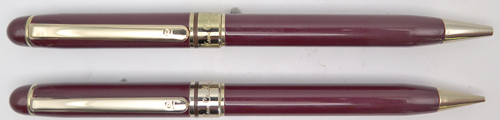ITEM #4908 SET: PIERRE CARDIN BALL POINT + PENCIL SET IN BURGANDY. GOLD PLATED TRIM. LIKE NEW CONDITION. PENCIL USES .036" LEAD. MECHANISMS BOTH WORK