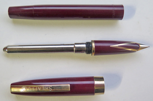 6305: SHEAFFER IMPERIAL TOUCHDOWN IN BURGUNDY WITH MEDIUM INLAID DOLPHIN NOSE 14K NIB. Gold filled trim. Clip has "SHEAFFER'S" written on it.