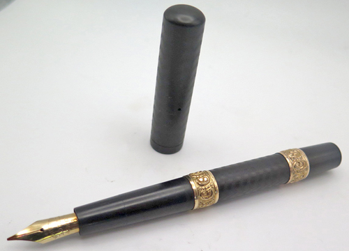 ITEM #6444: RARE WATERMAN EYEDROPPER 16 FOUNTIAN PEN IN BLACK CHASED HARD RUBBER. STONG CHASING AND NO BROWING ON SURFACE. IDEAL NEW YORK #6 FLEXIBLE 14K NIB IN FINE/MEDIUM. TWO GOLD FILL HAND-WORKED BANDS.