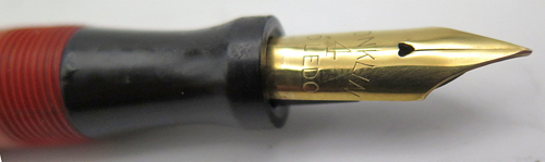 ITEM #6459: CONKLIN ORANGE ENDURA TOLEDO FOUNTAIN PEN. SPRING CLIP AND GOLD FILL TRIM. NIB IS "CONKLIN #4 TOLEDO" IN BROAD