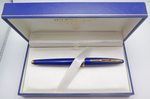 ITEM #6477: FRENCH MADE WATERMAN BLUE CARENE FOUNTIAN PEN IN ABYSS BLUE. BROAD 18K NIB. INCLUDES WATERMAN PISTON CONVERTER. EXCELLENT CONDITION. WITH BOX