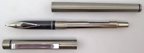 ITEM #6590: SHEAFFER TARGA SLIMLINE IN BRUSHED STAINLESS STEEL. MODEL 1001S. CHROME PLATED TRIM. BROAD STAINLESS STEEL NIB. NOS. Has slimline converter.