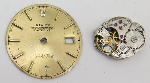 ITEM #6613: ROLEX WATCH FACE + PARTIAL INNER WORKS. GOLD COLOR.