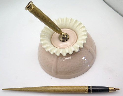 ITEM #6667: SHEAFFER LADY SKRIPSERT MOIRE GOLD DESK FOUNTAIN PEN WITH LENOX DESK BASE IN LIGHT PINK. NIB IS MEDIUM