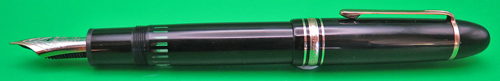 ITEM #6669: MONTBLANC MEISTERSTUCK 149 IN BLACK WITH GOLD PLATED TRIM. 2-TONE, 14K NIB IN MEDIUM. NIB HAS GOLD ON PERIMETER & SILVER COLORED METAL ON THE INSIDE. VERY CLEAN INK VIEW SECTION. Freshly lubricated piston. No serial number on cap ring.
