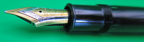 ITEM #6694: MONTBLANC MEISTERSTUCK 149 IN BLACK WITH GOLD PLATED TRIM. NIB IS 18C.NIB IS BROAD ON A PARKER FACTORY NIB GRADER. 2TONE NIB WITH GOLD ON OUTSIDE AND INNER CENTER, SILVER STRIP BETWEEN GOLD SECTIONS. Very clean ink view. No serial number on band. Clip washer says "Germany".