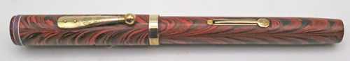 ITEM #6774: WATERMAN FOUNTAIN PEN #7 IN RED RIPPLE. "PINK" COLOR CODED NIB WHICH INDICATES A FLEX NIB. KEYHOLE BREATHER HOLE IN MEDIUM NIB. LEVER FILLER. CLEAR IMPRINT. 