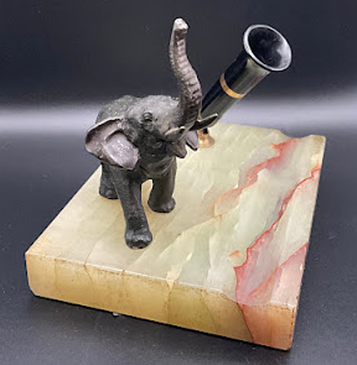 ITEM #6841: SHEAFFER MARBLE BASE WITH BRONZE ELEPHANT STATUE. DIMENSION OF BASE IS 5.5 x 4 x 4". BRASS SOCKET WITH BLACK PLASTIC PEN HOLDER + SINGLE BRASS BAND.