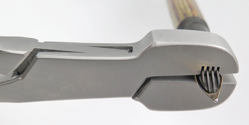 ITEM #PTS9: PELIKAN PLIERS WITH FOUR SLOTS FOR NIB/FEED REMOVAL OF PELIKAN 400, 400N & 100N. THESE PLIERS ARE DESIGNED TO REMOVE THE SCREW IN NIB/FEED ASSEBLEY. THERE ARE 4 SLOTS TO ACCEPT THE RIBS ON THE BOTTOM OF THE FEED. Make certain the slots are alligned with the feed before squeezing the pliers to avoid breaking feeds